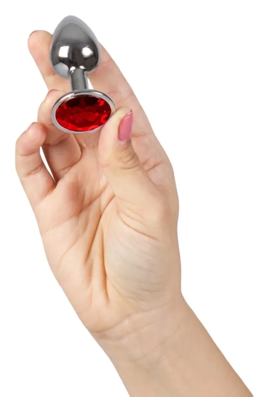 De Secretplay-plug met rood juweel, maat S, in de hand